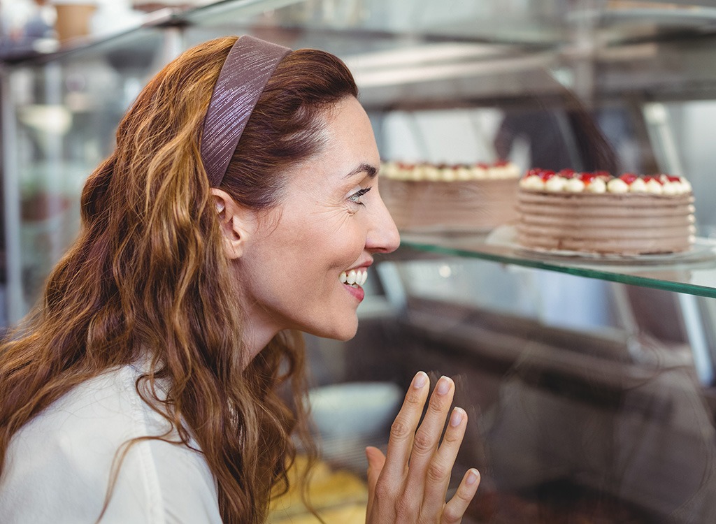 woman looking at desserts - pb2