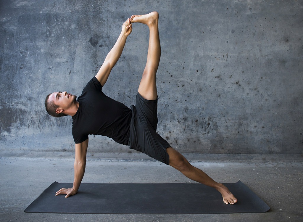 man doing side plank