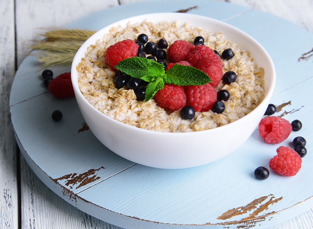 oatmeal in a white bowl with berries