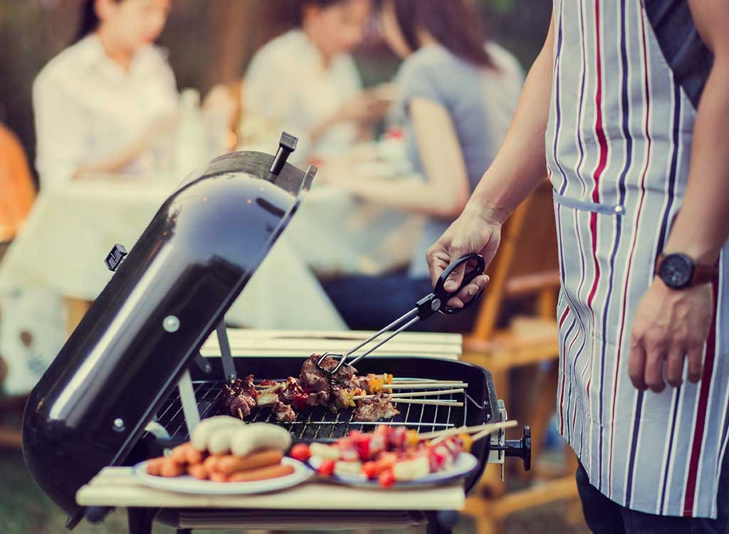 Man cooking on grill