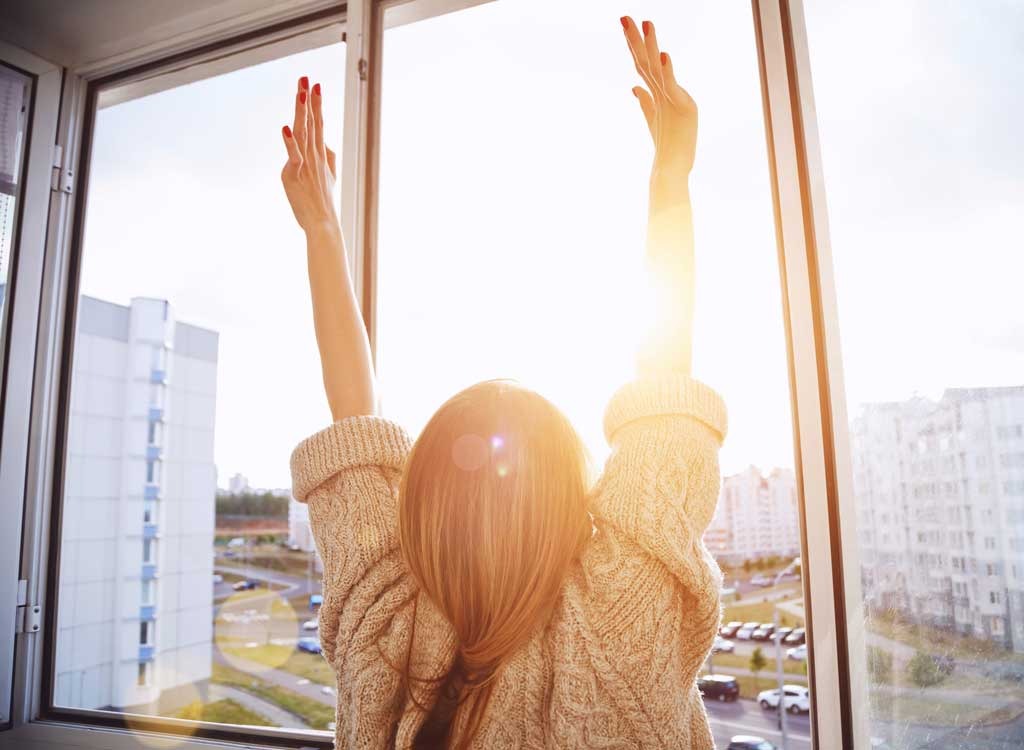 Woman in front of window