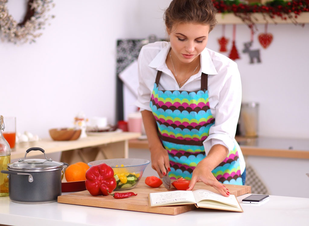 woman following recipe cooking
