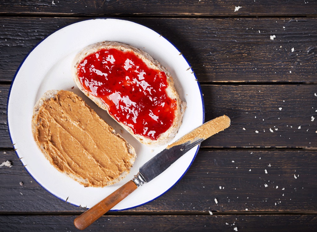 peanut butter and jelly sandwich with knife