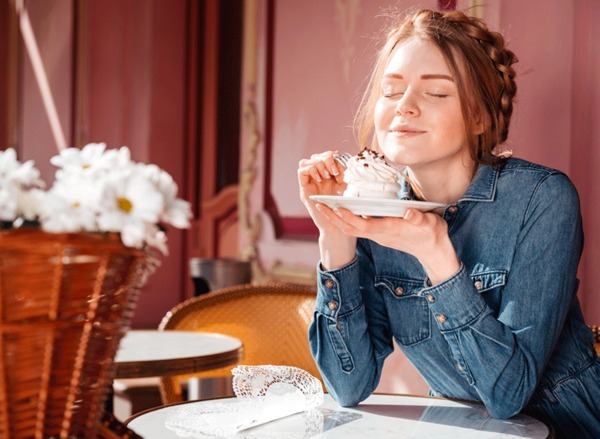 woman eating cupcake