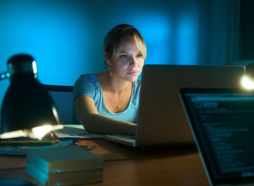 Woman working late at office
