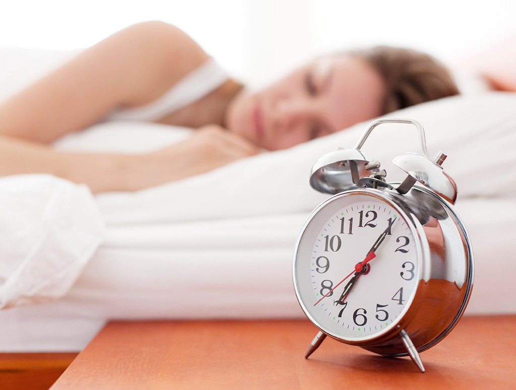 Woman sleeping alarm clock