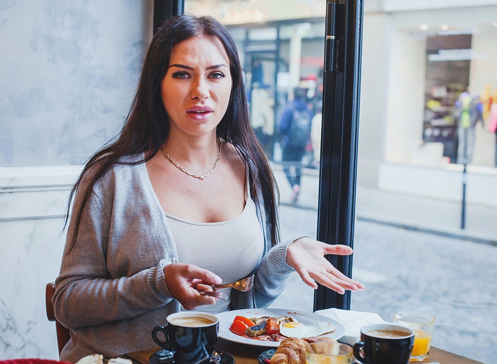 Unhappy woman at restaurant