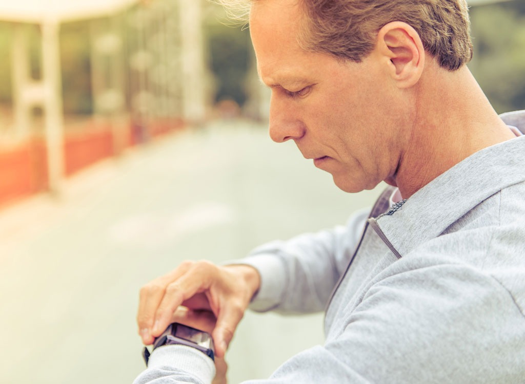 fitness man looking at watch