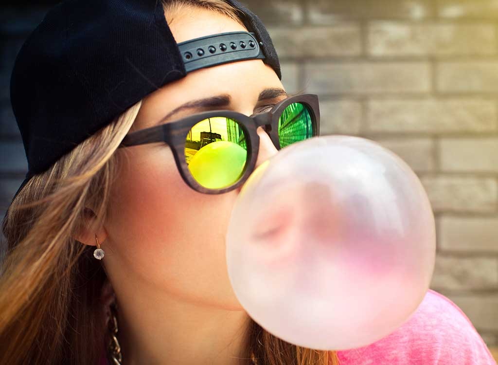 girl blowing gum bubble