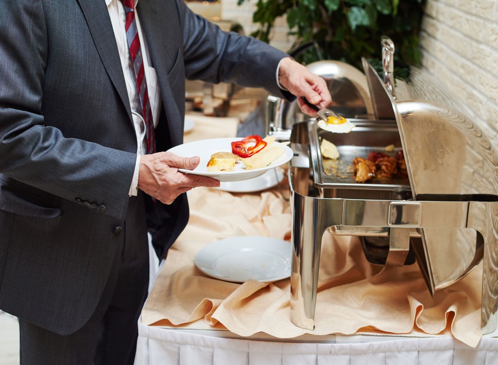 Hotel buffet food man in suit