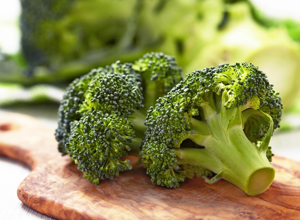 Broccoli on a wooden cutting board iron rich foods