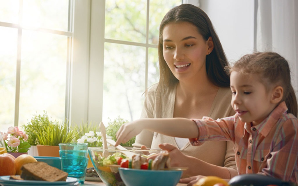 Mother and daughter cooking