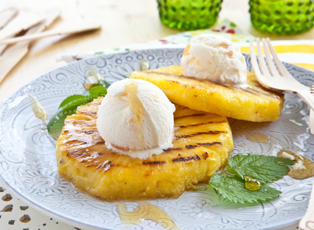 grilled pineapple topped with ice cream