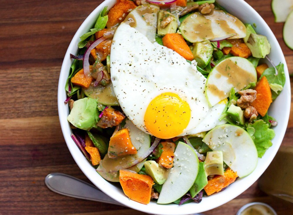 Salad with an egg in a bowl