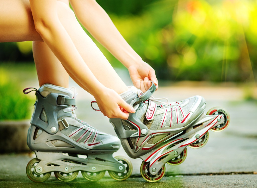 Woman putting on roller blades