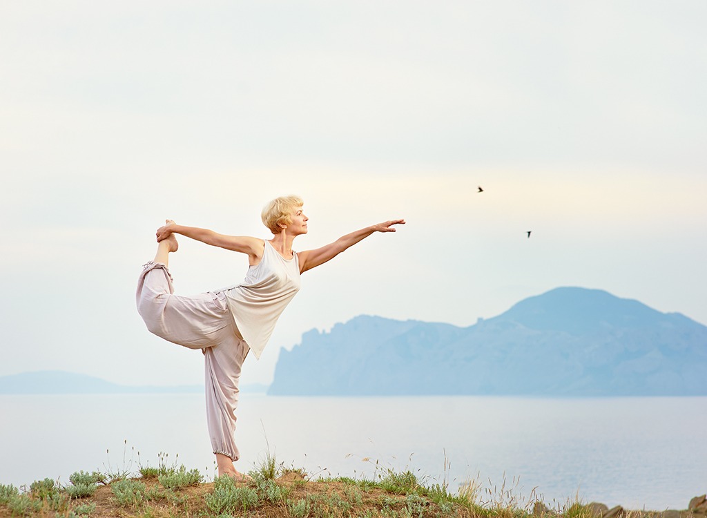 older woman practicing yoga