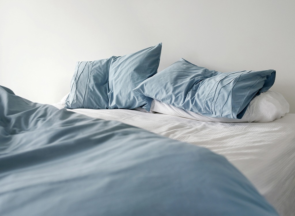 blue unmade bed