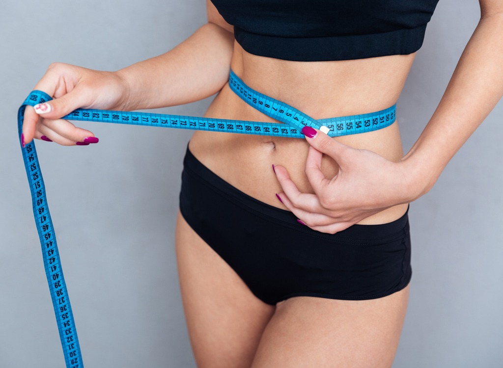 Woman measuring waist