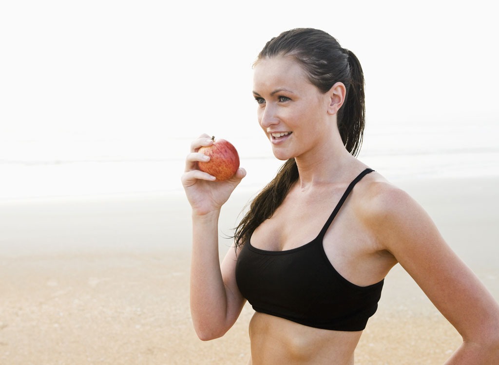 Woman eating apple