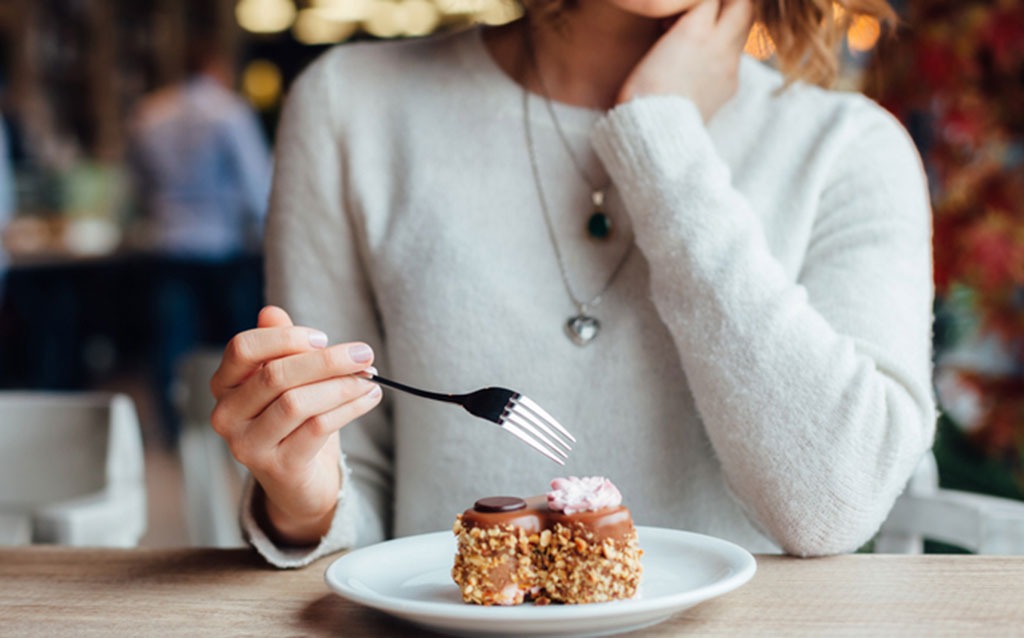 woman eating dessert