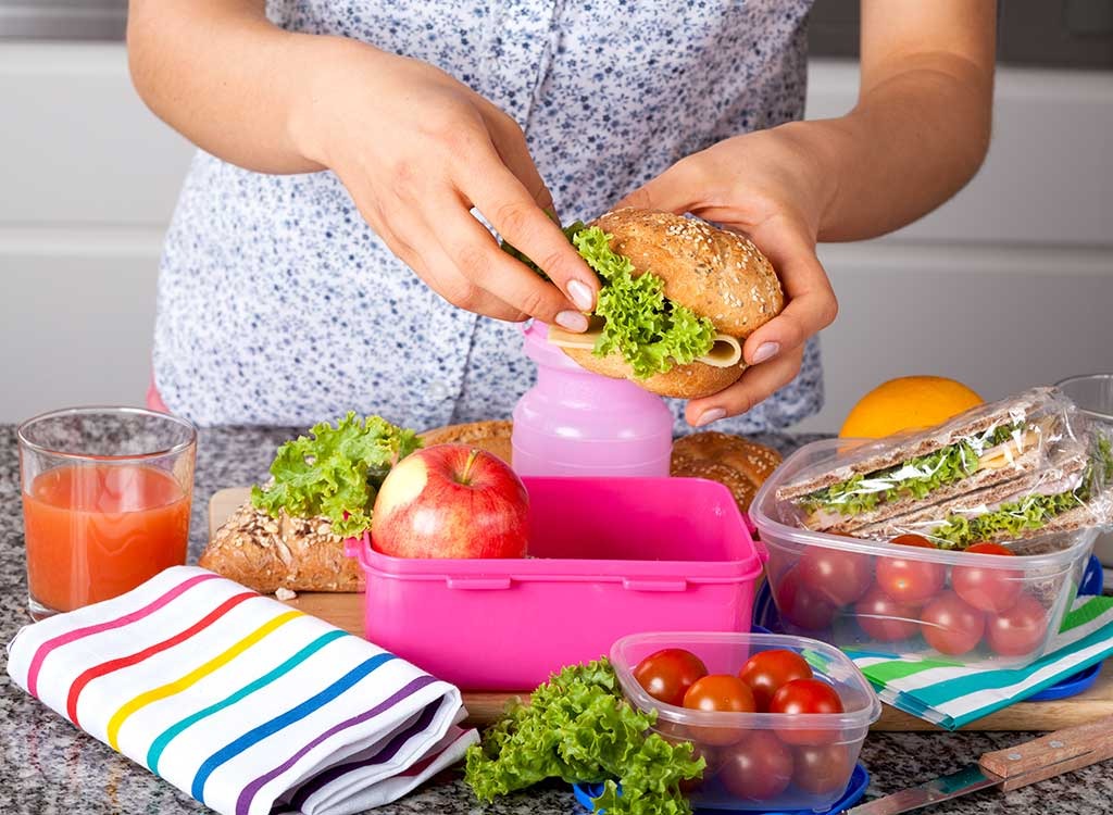 woman meal prepping lunch