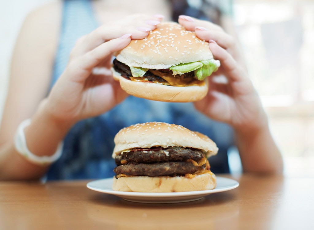 woman eating burgers