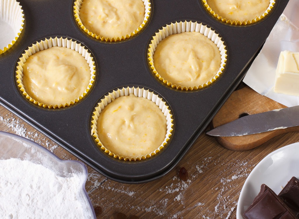 Muffin batter in baking tin