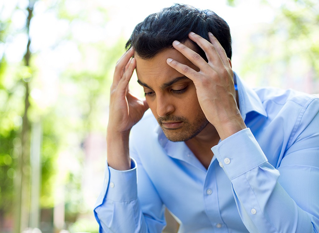 Man holding his head