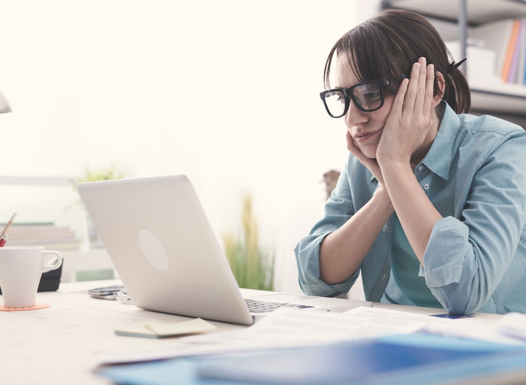 woman bored stressed work laptop