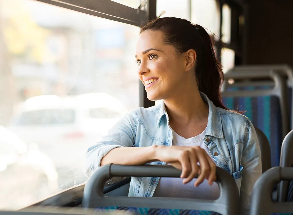 Woman on bus commuting