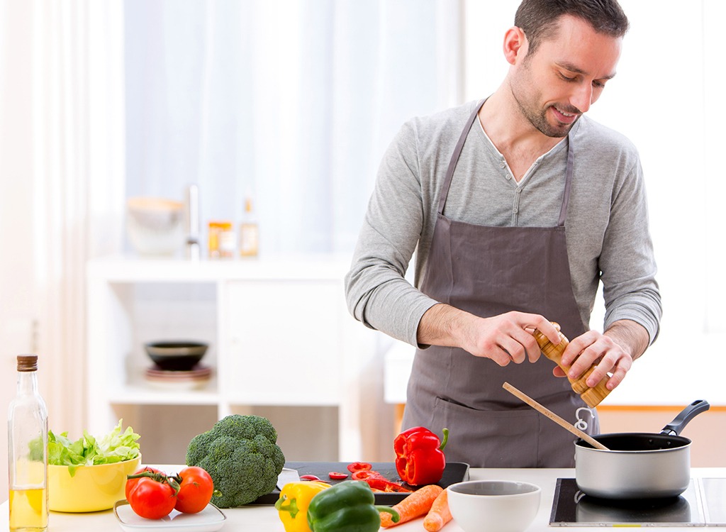 man cooking in kitchen