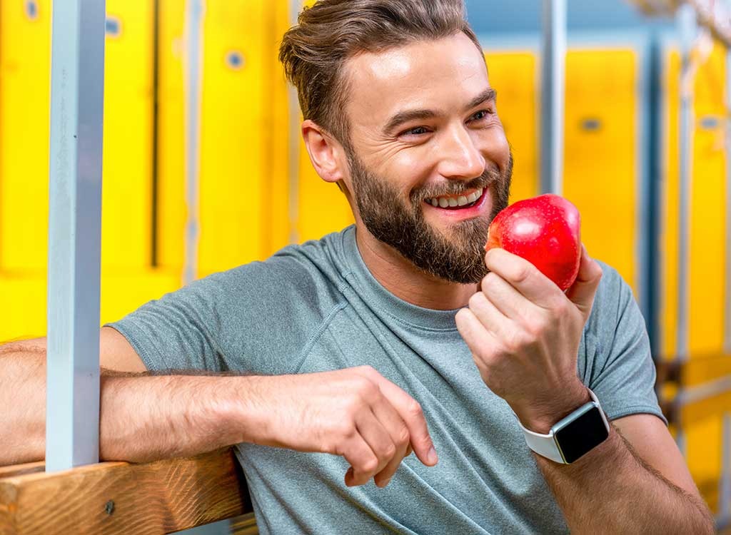 man eating apple