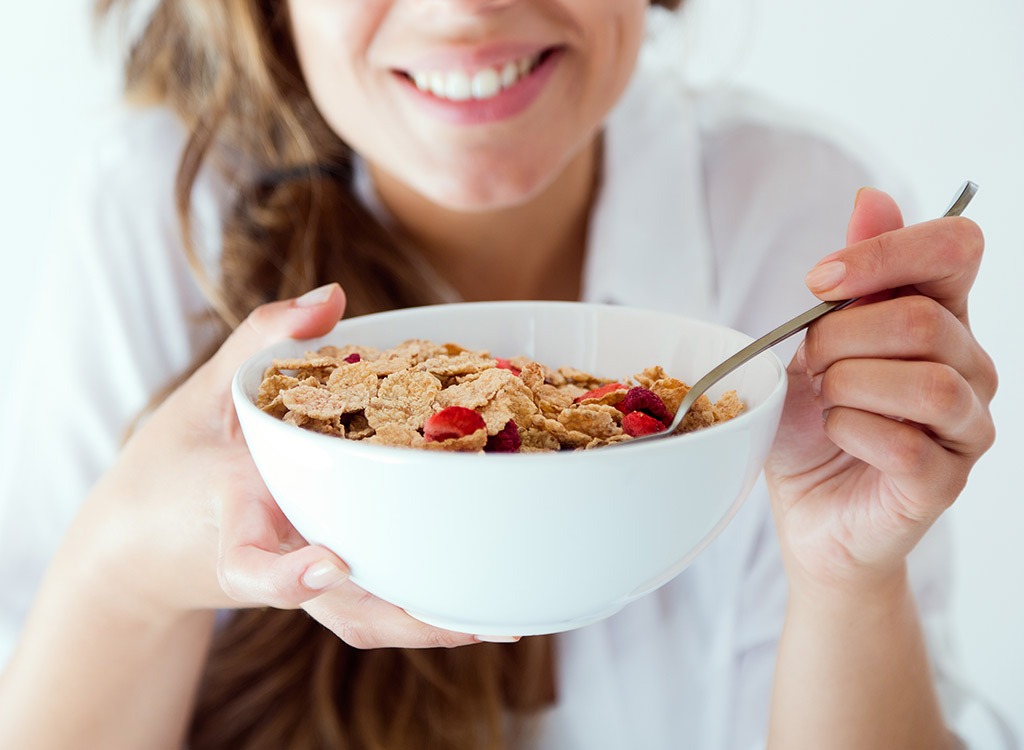 Woman eating a bowl of cereal - weight loss tips for night shift workers