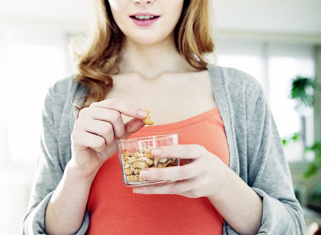 Woman eating nuts