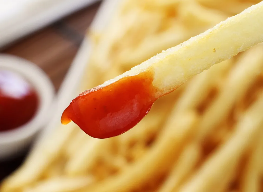 french fry dipped in ketchup