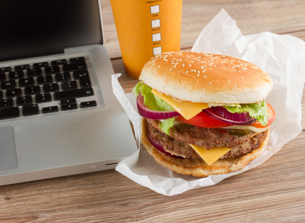 Burger next to a laptop