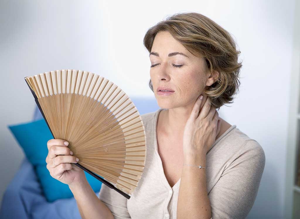 Woman fanning herself