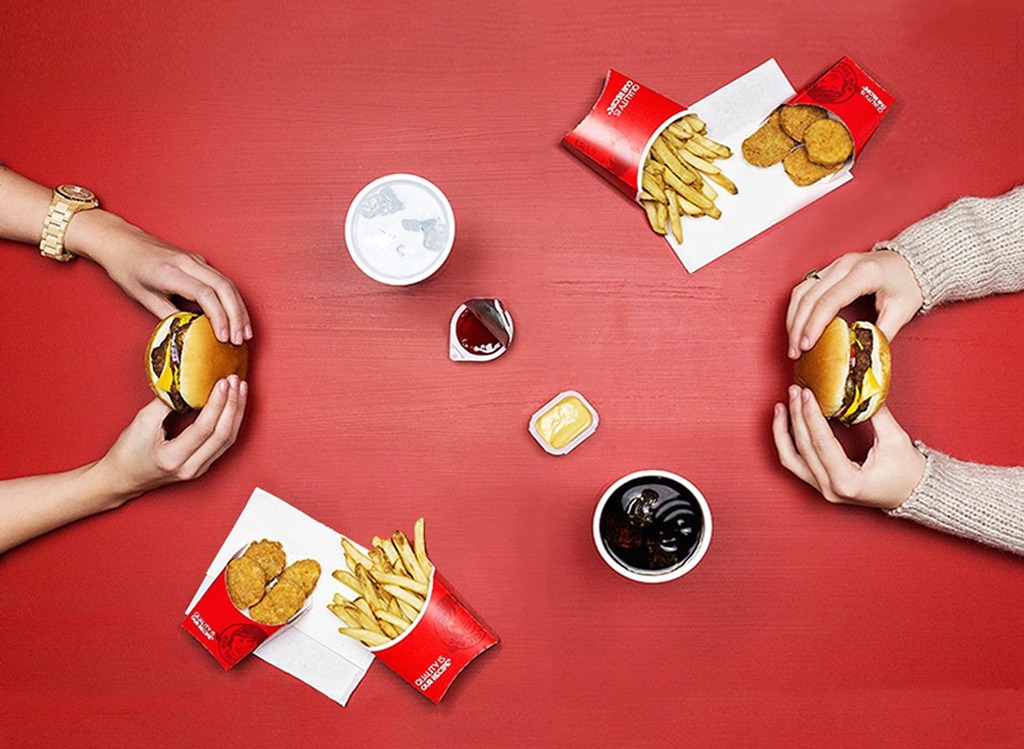 group eating wendys burgers fries nuggets