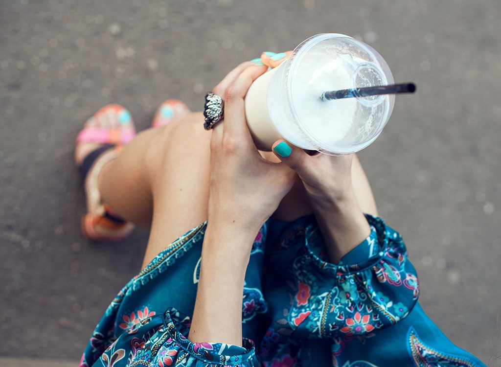 woman holding drink