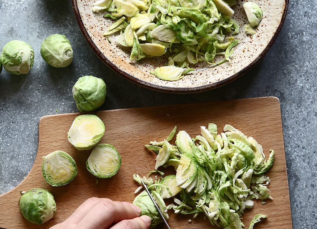 Brussels sprouts on wooden cutting board