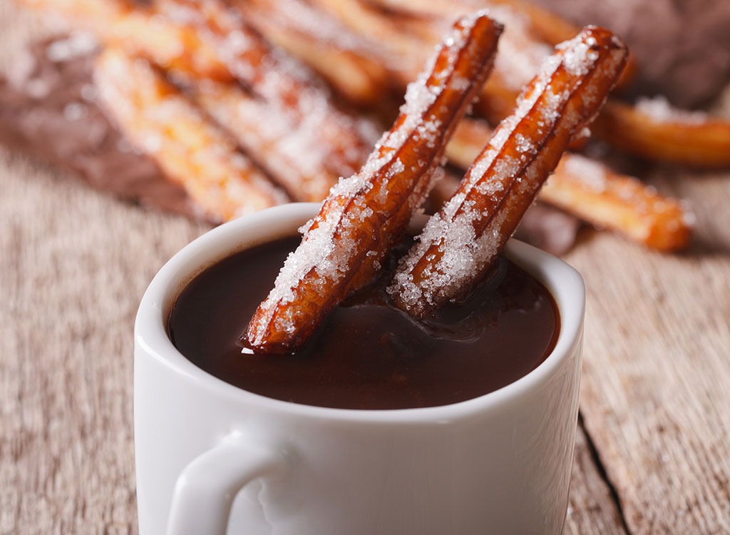 Sugar covered cinnamon sticks in cocoa