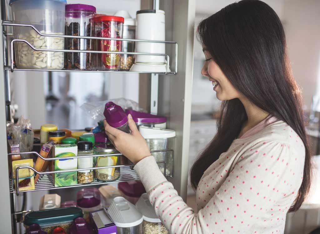 Woman looking in pantry