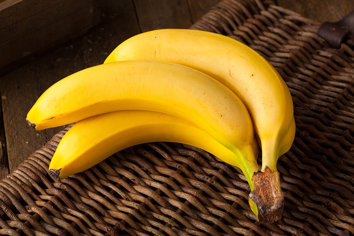 bunch of yellow bananas on wicker background