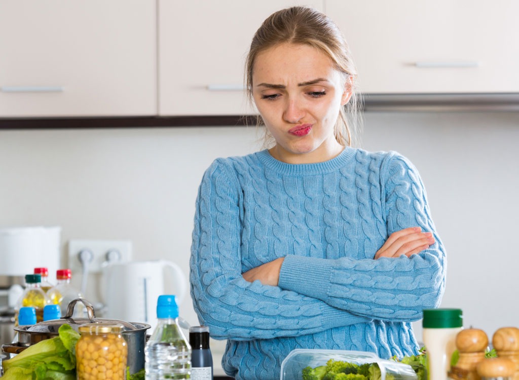 woman kitchen confused