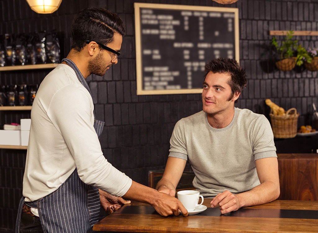 man being served coffee