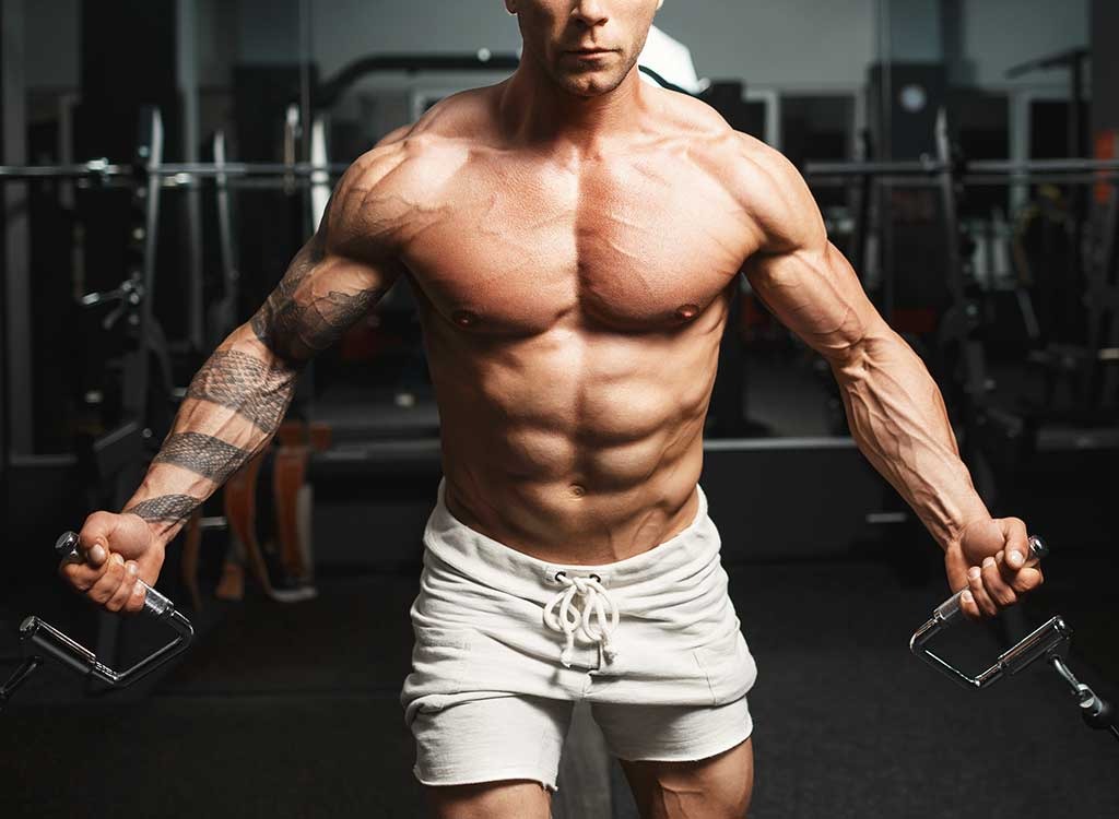 bodybuilder holding cables